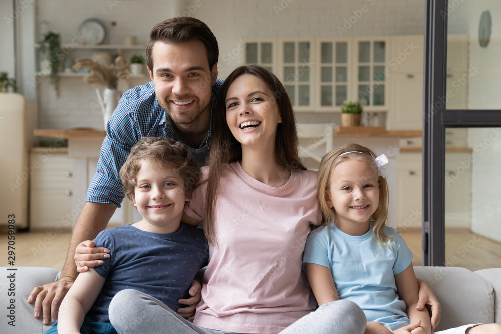 Portrait happy family with little daughter and son at home Portrait happy family with little daughter and son at home