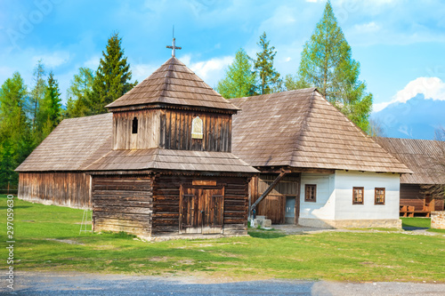 Old traditional houses and wooden belfry of village Pribylina in Liptov region (SLOVAKIA) - PANORAMA photo