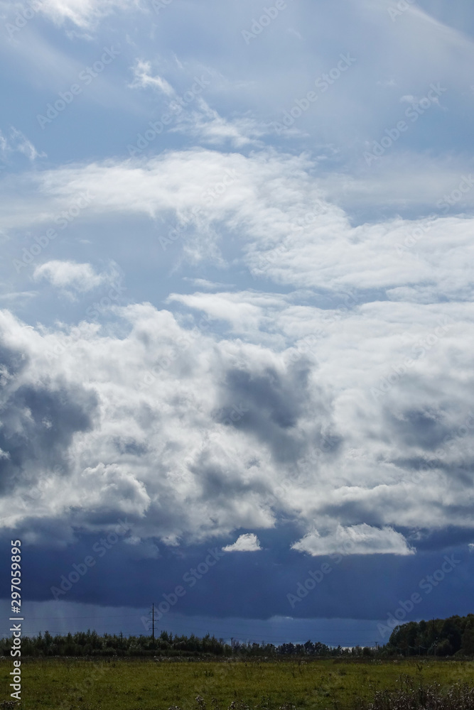 Rain clouds over the field. Autumn landscape. Russia Rain clouds over the field. Autumn landscape. Russia