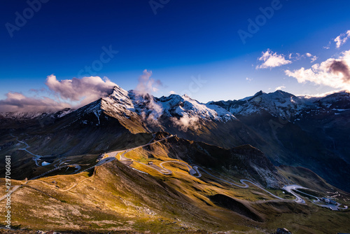 Panoramic View Over High Alpine Road and Snowy Mountains Peaks photo
