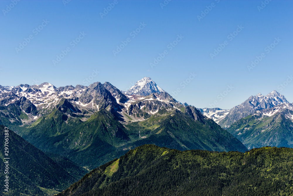 snowy peaks of the caucasian mountains on a summer day