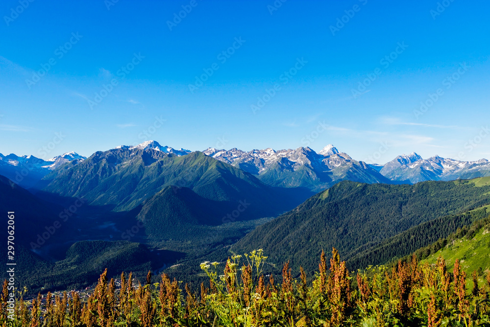Fototapeta premium snowy peaks of the caucasian mountains on a summer day