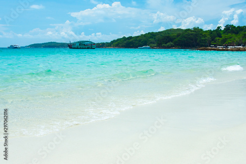 aqua sea water surface waves on white sandy beaches and clouds, natural blue sky. summer vacations at Samed island Rayong Thailand.