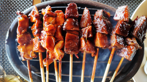 Indonesian grilled bbq meats with wooden skewers