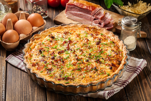 Homemade quiche lorraine with bacon and cheese photo