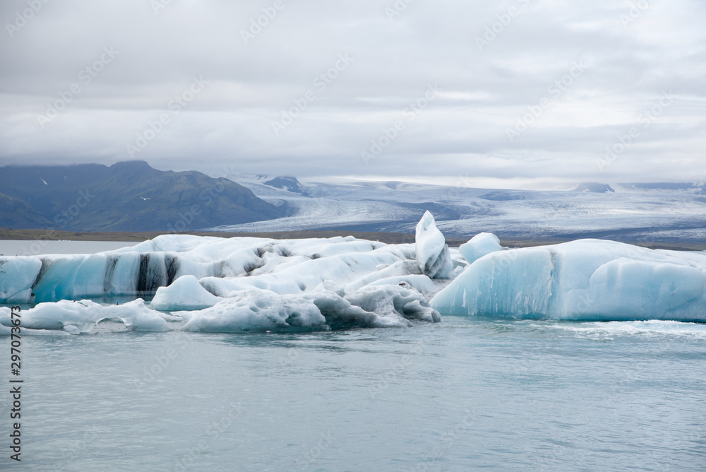 Icebergs in the Jökulsárlón glacier lake in Iceland in winter. Photographed at cloud. Icebergs in the Jökulsárlón glacier lake in Iceland in winter. Photographed at cloud.