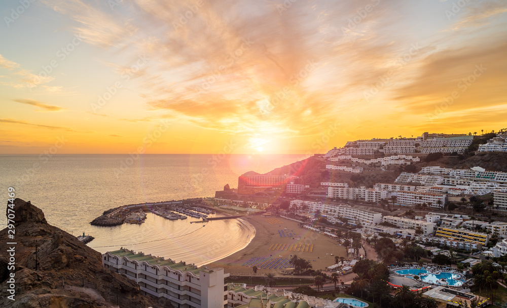 Amazing landscape with sunset at Puerto Rico village and beach on Gran Canaria, Spain