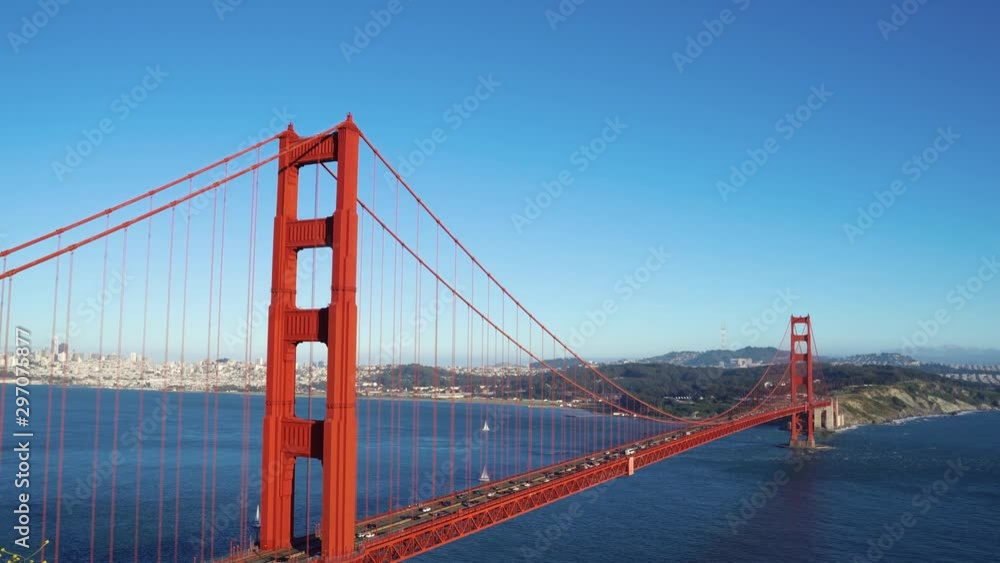beautiful town with houses located on island connected with red iron Golden Gate Bridge San Francisco California. blue ocean clear water sea by mountain amazing nature view. cars diving pass cross beautiful town with houses located on island connected with red iron Golden Gate Bridge San Francisco California. blue ocean clear water sea by mountain amazing nature view. cars diving pass cross