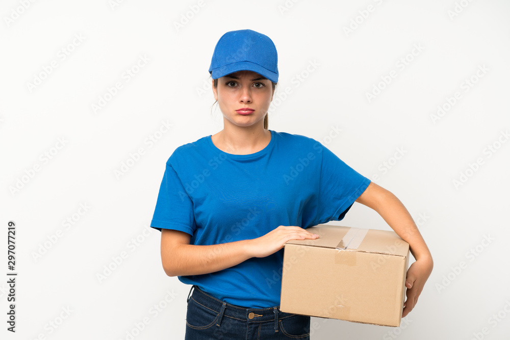 Young delivery girl over isolated white background sad Young delivery girl over isolated white background sad