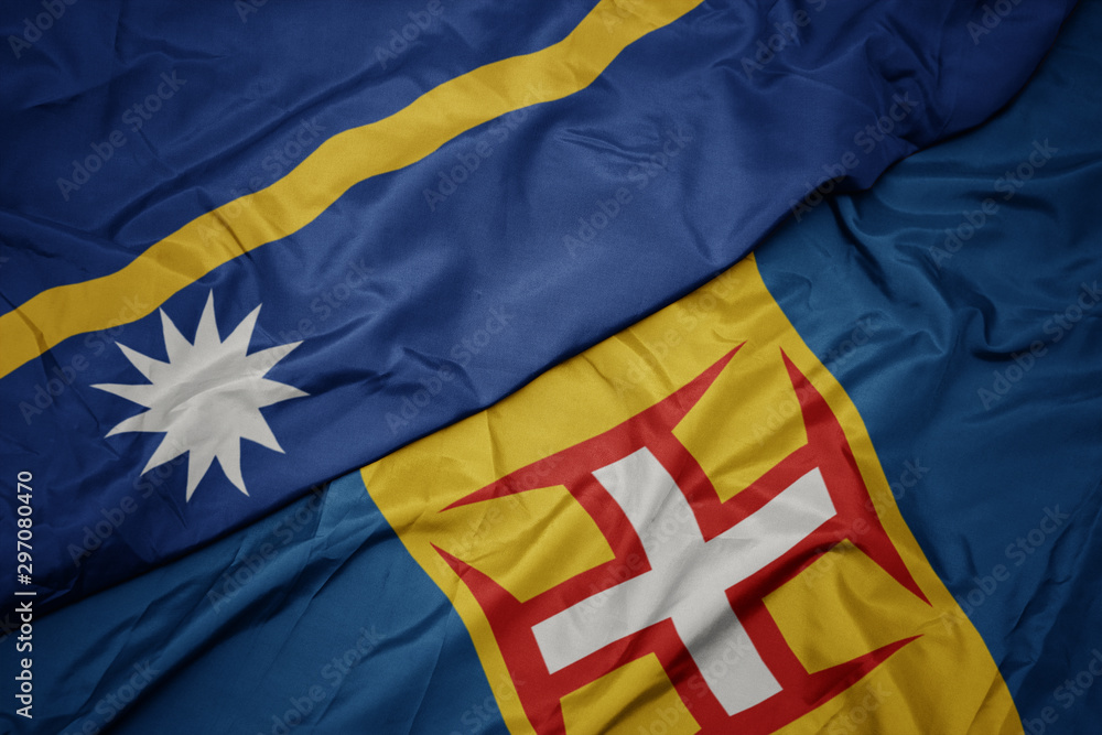 waving colorful flag of madeira and national flag of Nauru .