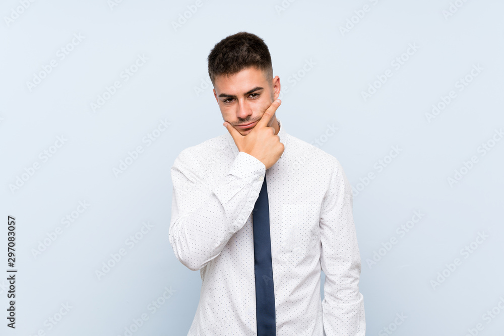Handsome businessman over isolated blue background thinking an idea Handsome businessman over isolated blue background thinking an idea