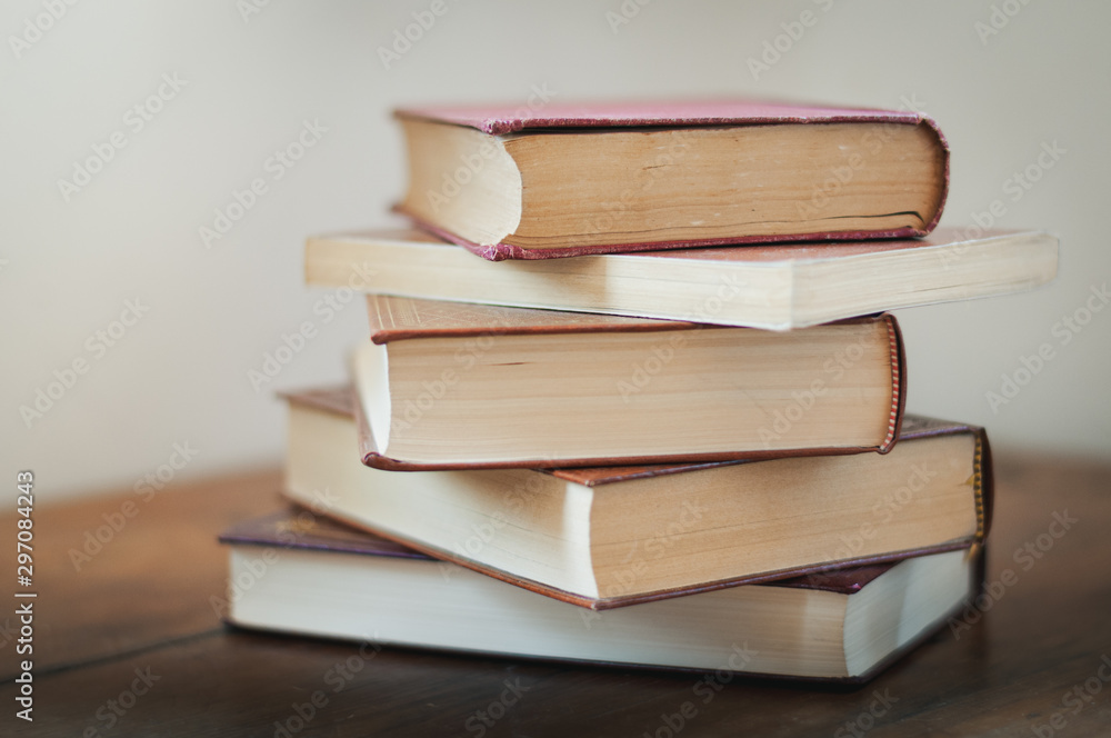 A pile of books on a table. A pile of books on a table.