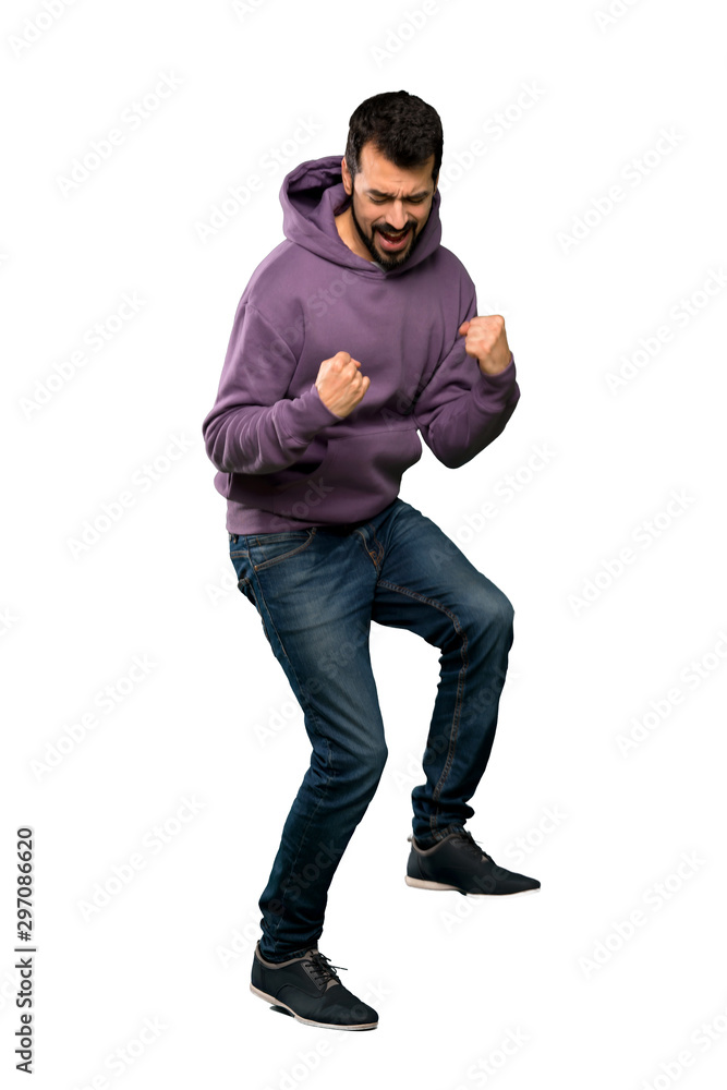 Naklejka premium Handsome man with sweatshirt jumping