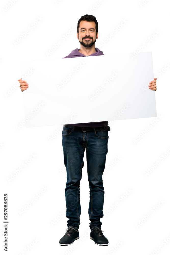 Handsome man with sweatshirt holding an empty placard Handsome man with sweatshirt holding an empty placard