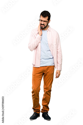 Full-length shot of Handsome man with beard with toothache over isolated white background