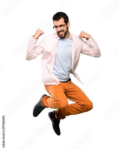 Handsome man with beard jumping