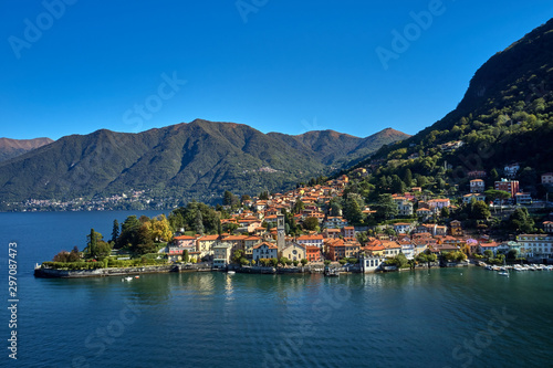 Panoramic top view of Lake Como. Lombardy, Italy. The small town of Torno. Autumn season. Perfect clear blue sky. Boats parked off the coast © Berg