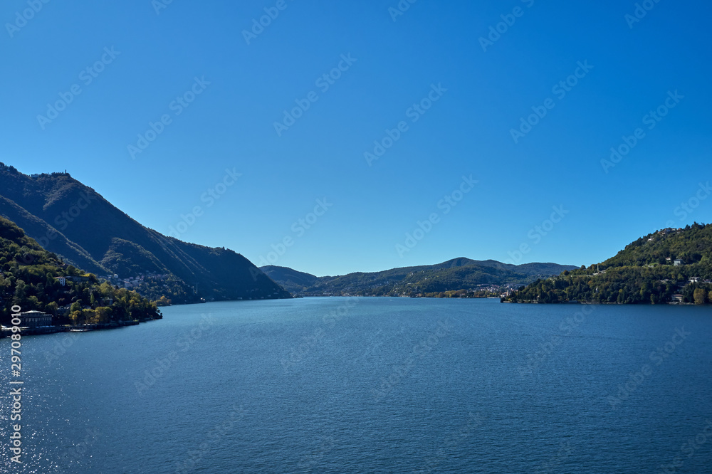 Panoramic top view of Lake Como. Lombardy, Italy. Autumn season. Perfect clear blue sky.