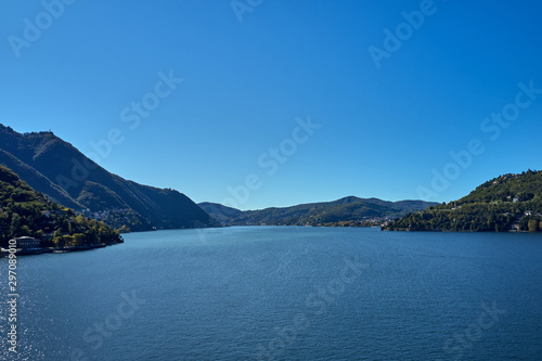 Panoramic top view of Lake Como. Lombardy  Italy. Autumn season. Perfect clear blue sky.
