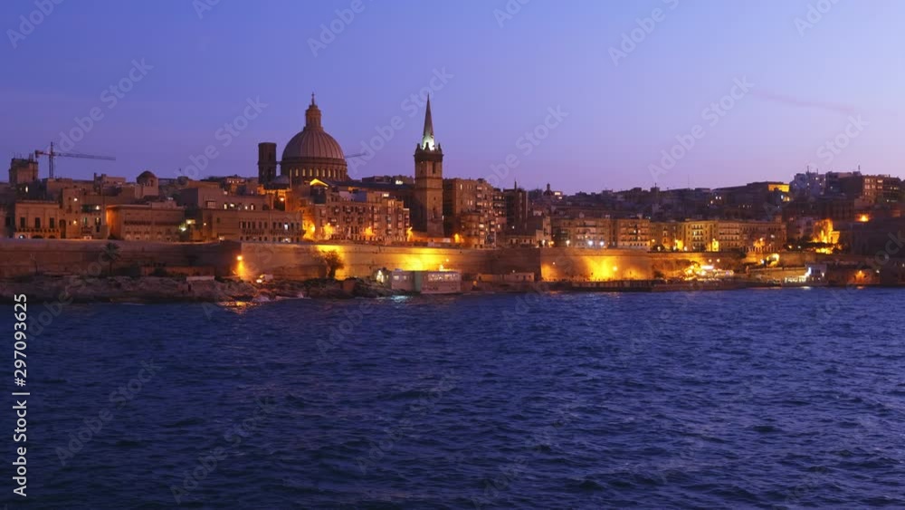 City of Valletta in Malta in the evening, skyline from the Marsamxett Harbour. City of Valletta in Malta in the evening, skyline from the Marsamxett Harbour.