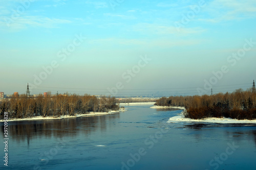 The cold Yenisei river. Krasnoyarsk. Tree branches in the snow. Pure white snow. Winter fairy forest. Background for postcard. Frosty morning.