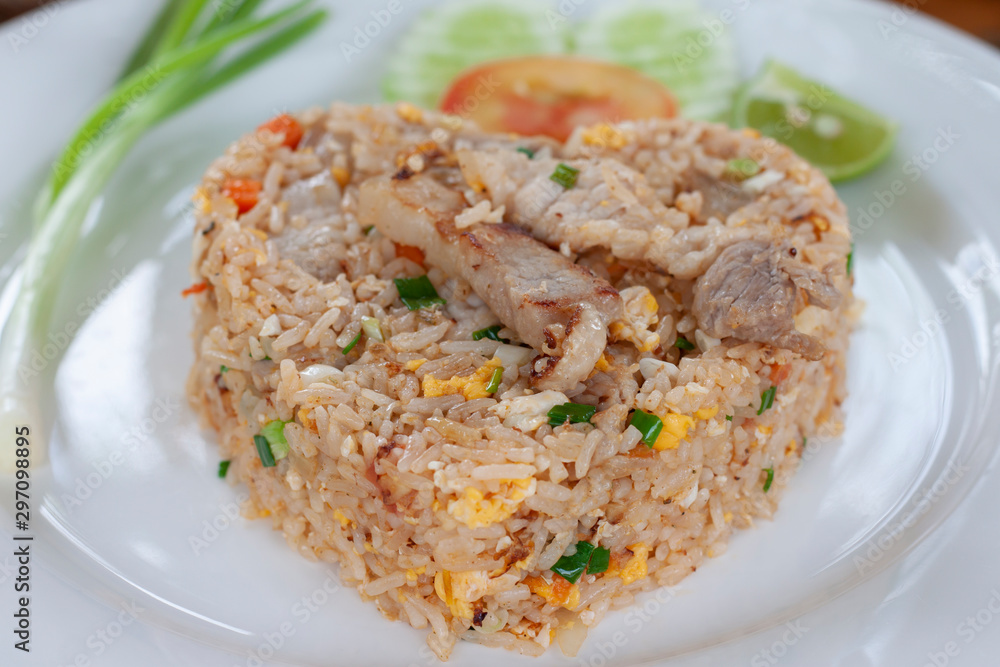 Closeup Fried rice with pork in white plate. Closeup Fried rice with pork in white plate.