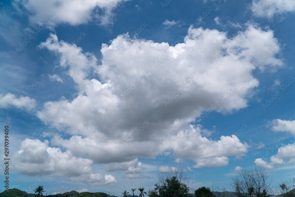 Obraz premium A big, white cloud on the blue sky