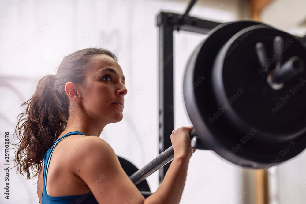 Woman with dumbbell weight training equipment. Woman with dumbbell weight training equipment.