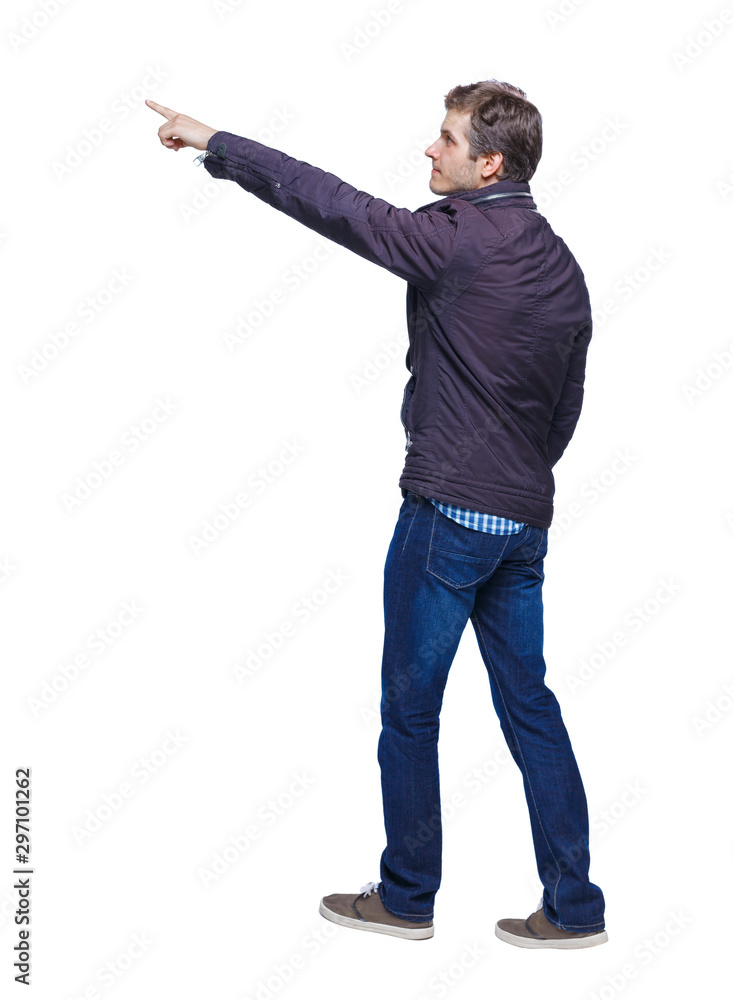 Back view of a man walking with a pointing hand. Back view of a man walking with a pointing hand.