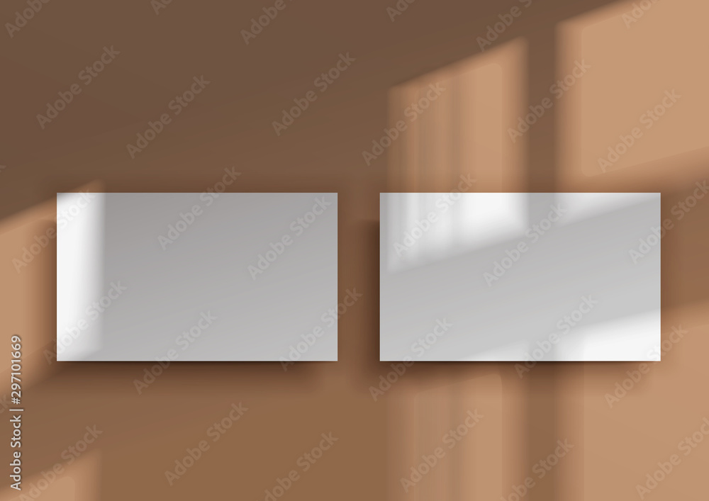 Two business cards. Overlay shadow from the window Two business cards. Overlay shadow from the window
