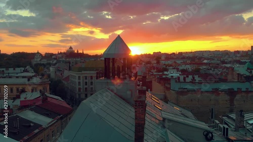 Sunset on roofs column chimney photo