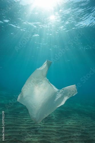 Plastic bag pollution underwater with sunlight in the sea, Mediterranean, natural scene, France