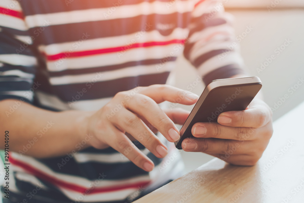 Close-up image of male hands using mobile smartphone, searching or typing message Close-up image of male hands using mobile smartphone, searching or typing message