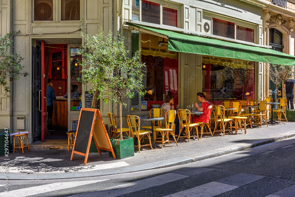 Cozy street with tables of cafe in Paris, France Cozy street with tables of cafe in Paris, France