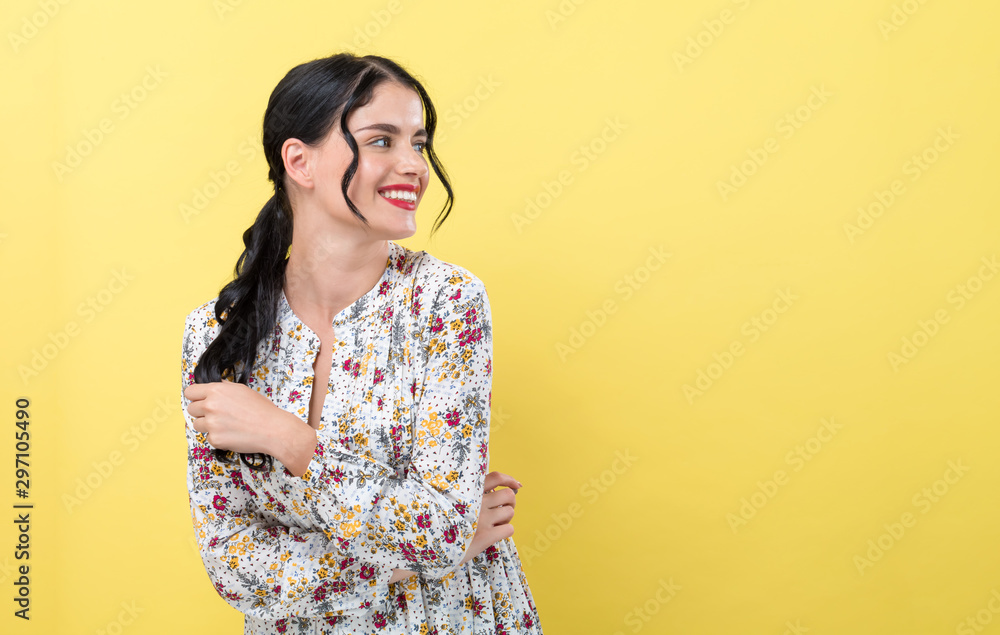 Happy young woman on a yellow background Happy young woman on a yellow background