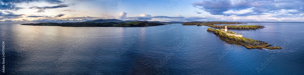 Aerial of the Rotten Island Lighthouse with Killybegs in background - County Donegal - Ireland Aerial of the Rotten Island Lighthouse with Killybegs in background - County Donegal - Ireland