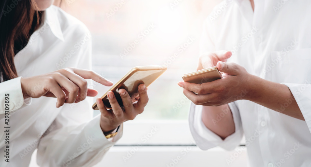 Closeup woman and man hand using smartphone together. Closeup woman and man hand using smartphone together.