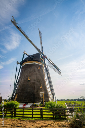 european dutch old windmill landscape with blue sky