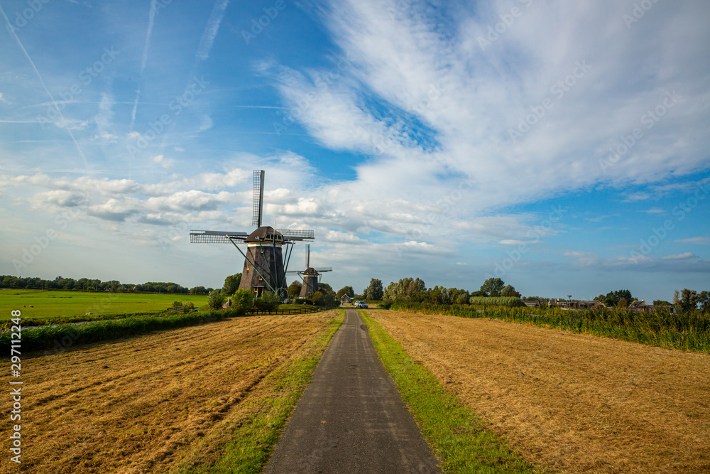 european dutch old windmill landscape with blue sky european dutch old windmill landscape with blue sky