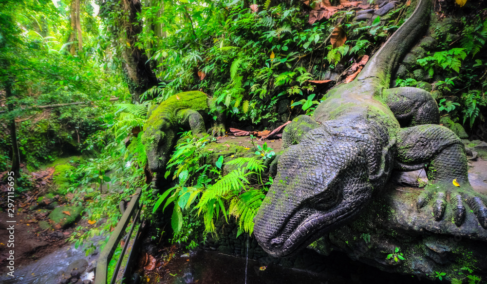 ancient komodo dragon statue in monkey forest Ubud Bali ancient komodo dragon statue in monkey forest Ubud Bali
