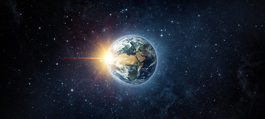 Panoramic view of the Earth, sun, star and galaxy. Sunrise over planet Earth, view from space. Elements of this image furnished by NASA
