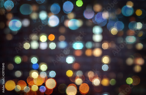 Night city multi-colored circular reflections. Blured Christmas, New Year, science abstract light. Abstract defocused background.