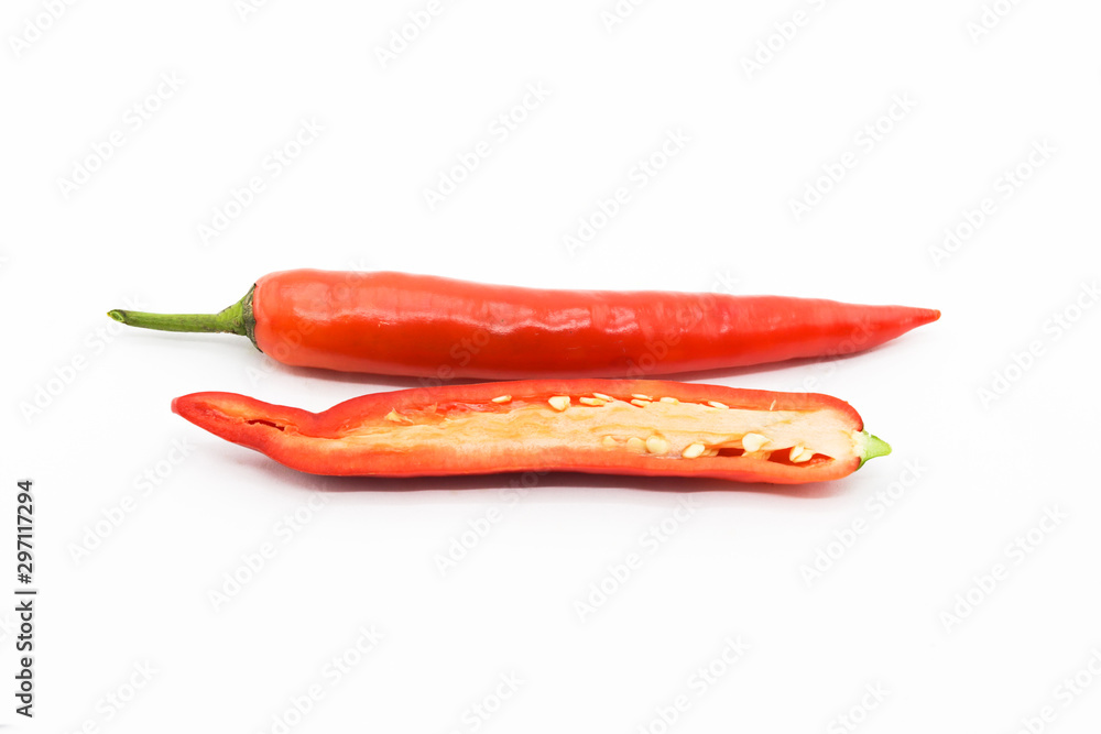 Whole chili and half sliced red chili pepper on white back ground