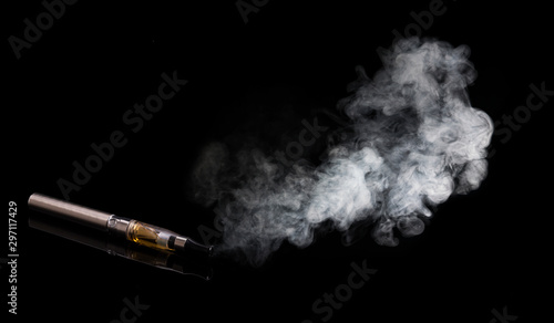 Electronic cigarettes. Smoke, closeup, on black background. 