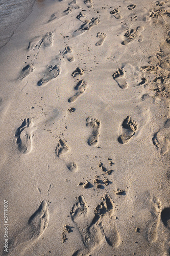 Footprints on a beach in the South of Italy. Portrait format.