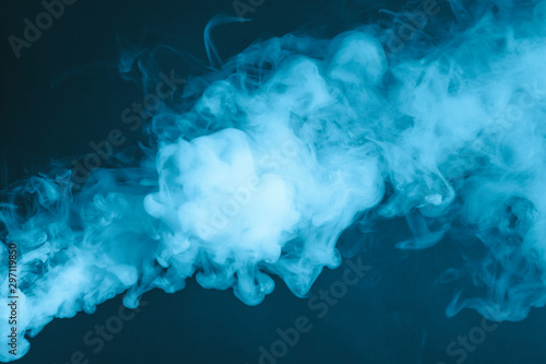 Cloud of vapor. Dark blue background photo