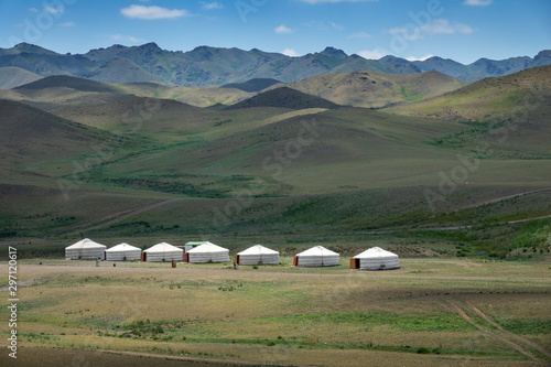 Traditional yurts between montains at sunset, Mongolia