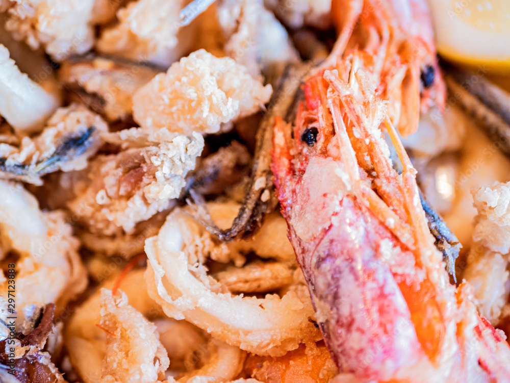 Typical Italian dish, mixed fried fresh fish with squid rings, sardines