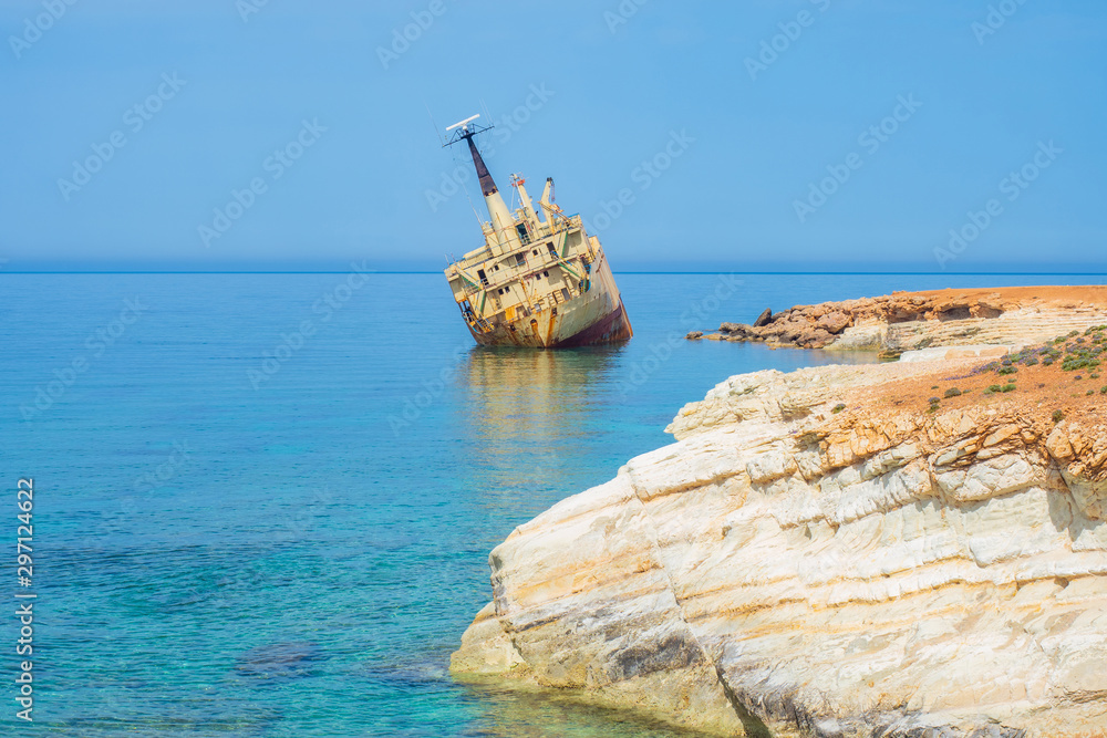 Republic of Cyprus. Pathos. Ship aground. White stones on the Mediterranean coast. Shipwreck. Abandoned naval vessel. View of the ship from the shore. Tourist attractions in Cyprus.