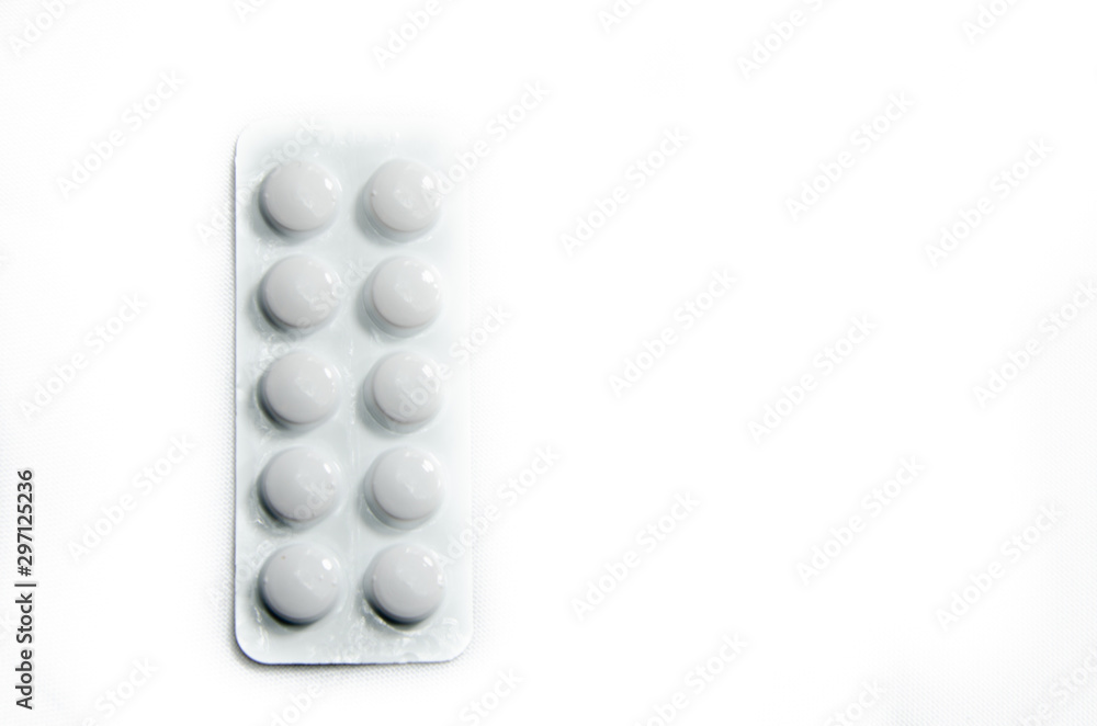 White light plate of medicine pills on a white background White light plate of medicine pills on a white background